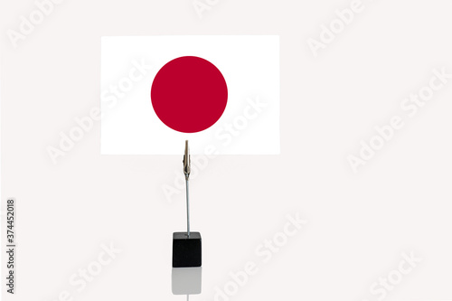 unitary state and constitutional monarchy of Japan miniature flag in cube base in photograph holder on a white background Free Download unitary state and constitutional monarchy of Japan miniature flag in cube base in photograph holder on a white background - GFXLoad