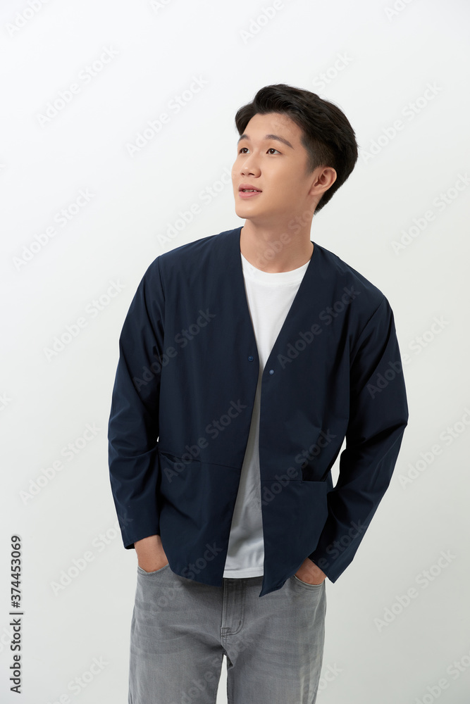 Portrait of young handsome man standing isolated over white background. Portrait of young handsome man standing isolated over white background.