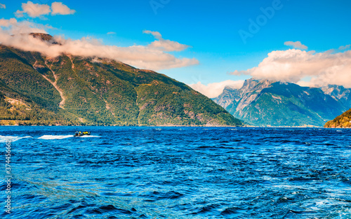 Fjord landscape with ferryboat in Norway photo