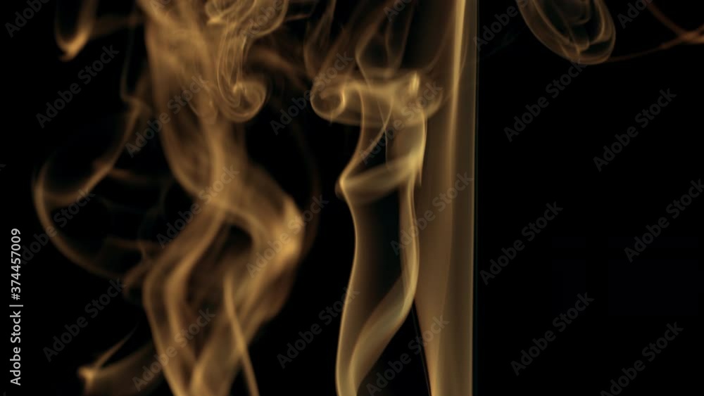Stream Of Orange Smoke On Black Background Rises Up. Stream Of Orange Smoke On Black Background Rises Up.