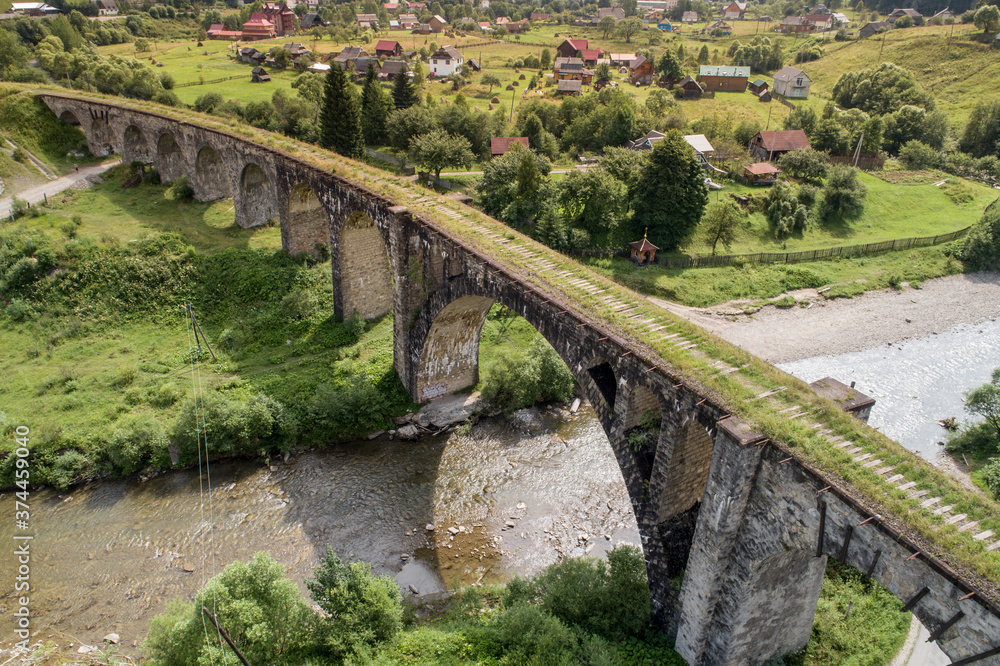 Aerial view of railway viaduct in Vorokhta village, Carpathians mountains, Ukraine Aerial view of railway viaduct in Vorokhta village, Carpathians mountains, Ukraine