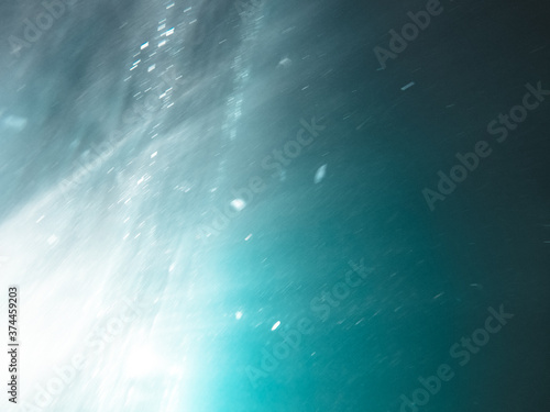 underwater texture shot blue sea water with sunbeam © lotusstock
