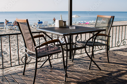 restaurant tables on the terrace near the beach