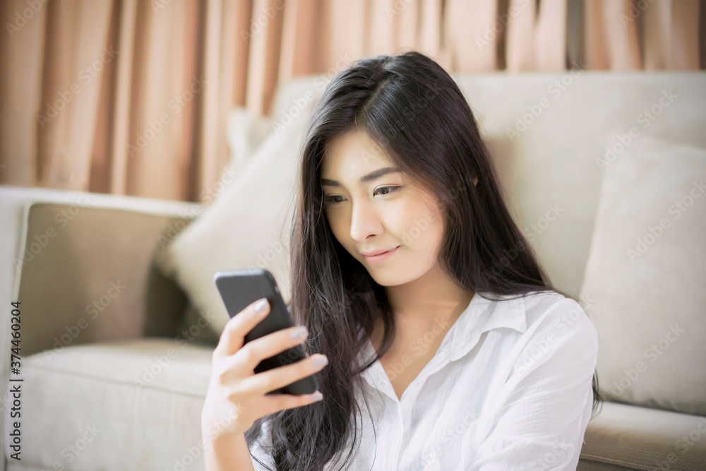 beautiful woman using touching interacting mobile phone device surfing internet resting on sofa hotel room comfortably relaxing smiling enjoying care free time of holiday vacation and accommodation beautiful woman using touching interacting mobile phone device surfing internet resting on sofa hotel room comfortably relaxing smiling enjoying care free time of holiday vacation and accommodation