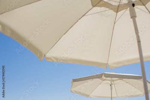 beach umbrellas against the blue sky