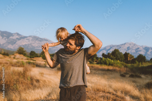 Family time father and child daughter playing together outdoor active healthy lifestyle vacations travel together with kid happy emotions summer vibes photo