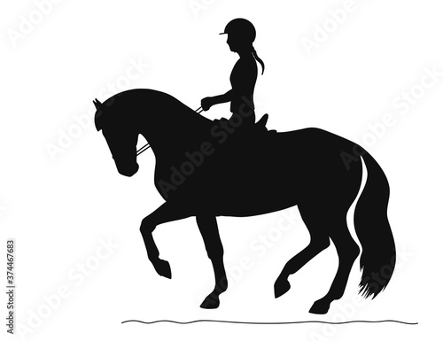 Black silhouette of a athlete during a training session on a horse