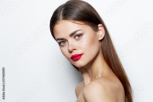 Girl skin care Woman naked shoulders red lips look ahead 