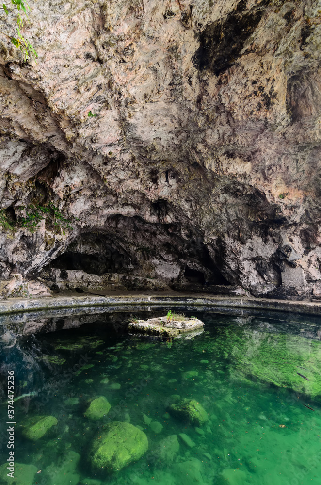 Grotta Di Sperlonga - A huge cave with the remains of a pool and a fountain from the grotto offers a magnificent view of the village of Sperlonga,Italy Grotta Di Sperlonga - A huge cave with the remains of a pool and a fountain from the grotto offers a magnificent view of the village of Sperlonga,Italy