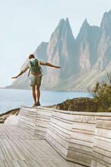 Man traveller exploring Norway traveling solo summer vacations active healthy lifestyle outdoor Okshornan peaks landscape