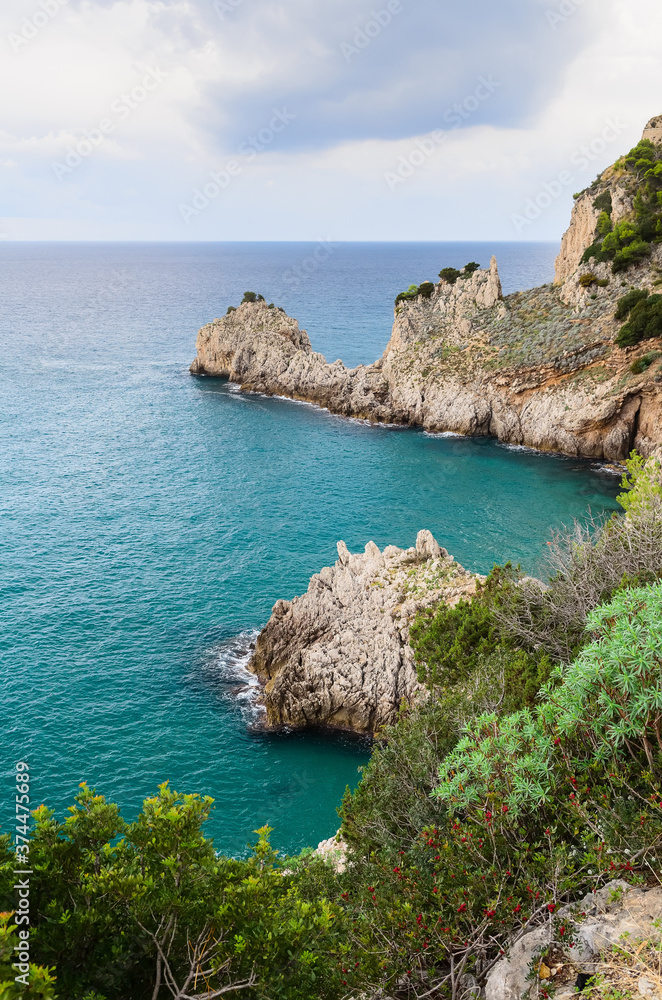 Beautiful view of a bay in the cliffs. Mediterranean coast, southern Italy