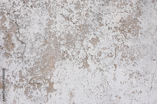 Matière brute de mur en béton avec de la peinture blanche