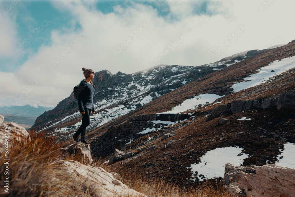 Young female hiker on snowy mountain