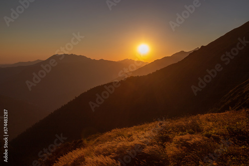 Wallpaper Mural Sunset in the mountains a scenic natural landscape Torontodigital.ca