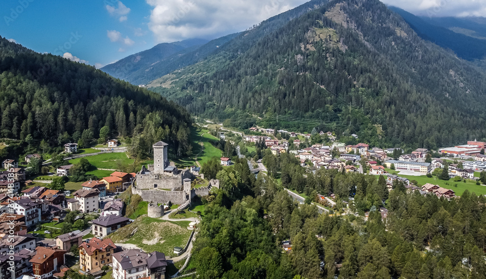 St. Michael castle in Ossana stands on a rocky outcrop. Ossana castle in the village of Ossana in Val di Sole, Trentino Alto Adige, Italy. Panoramic view