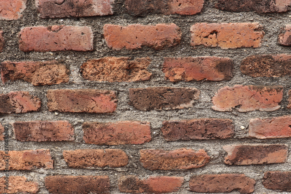 Obraz premium The walls are made of antique bricks at Chaimongkol temple.location Ayutthaya province Thailand, is very old,about 200 years old,strong, durable and is a traditional Thai art,suitable a ิbackground.