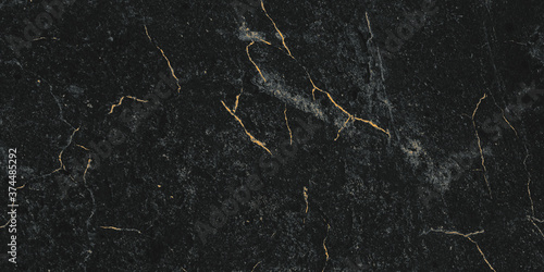 Black marble texture, golden patterns. Background surface