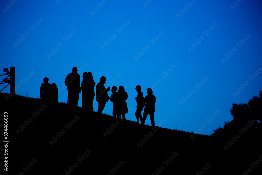 Silhouette of a group of people against the sky Silhouette of a group of people against the sky