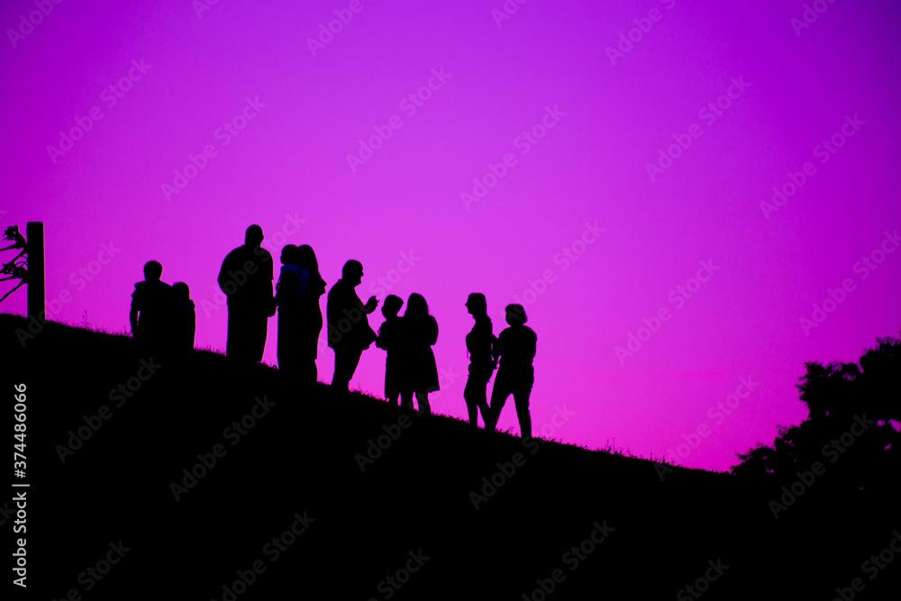 Silhouette of a group of people against the sky Silhouette of a group of people against the sky