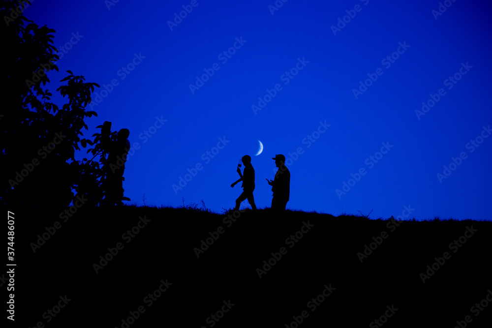 Silhouette of a group of people against the sky