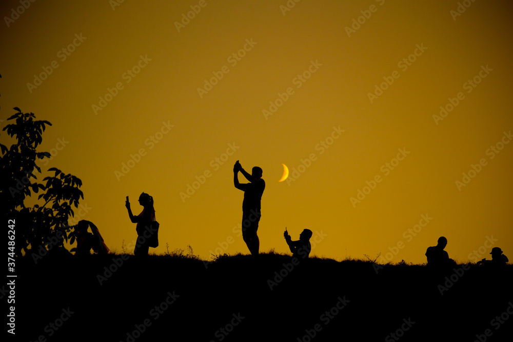 Silhouette of a group of people against the sky Silhouette of a group of people against the sky