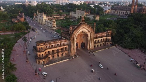 drone shot of Rumi darwaza in lucknow at sunset with road and moving cars photo