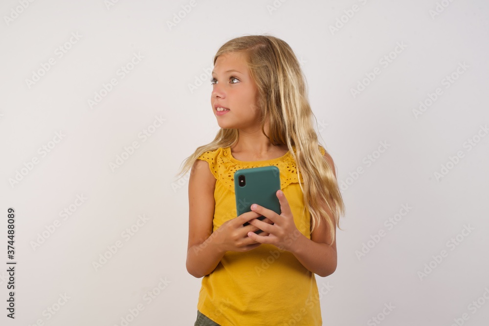 Copyspace photo of charming Little girl with beautiful blonde hair over white background pretty attractive gorgeous sweet lovely stupor with something occurring in social media Copyspace photo of charming Little girl with beautiful blonde hair over white background pretty attractive gorgeous sweet lovely stupor with something occurring in social media