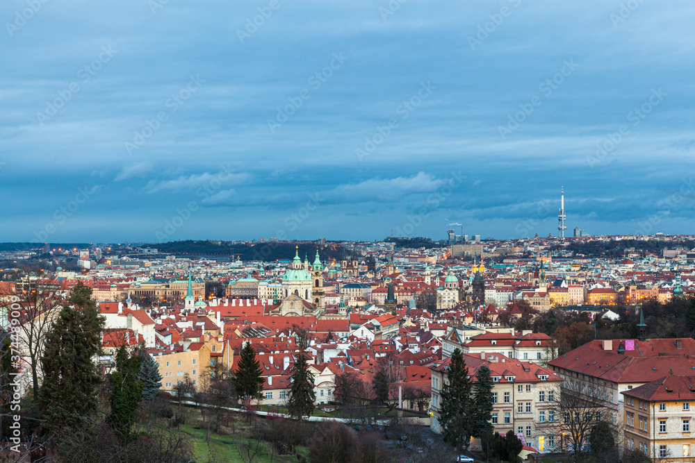Panorama aerial view of Prague cityscape and skyline with Mala Strana and old town from Petrin Hill at winter dusk, Czech Republic.