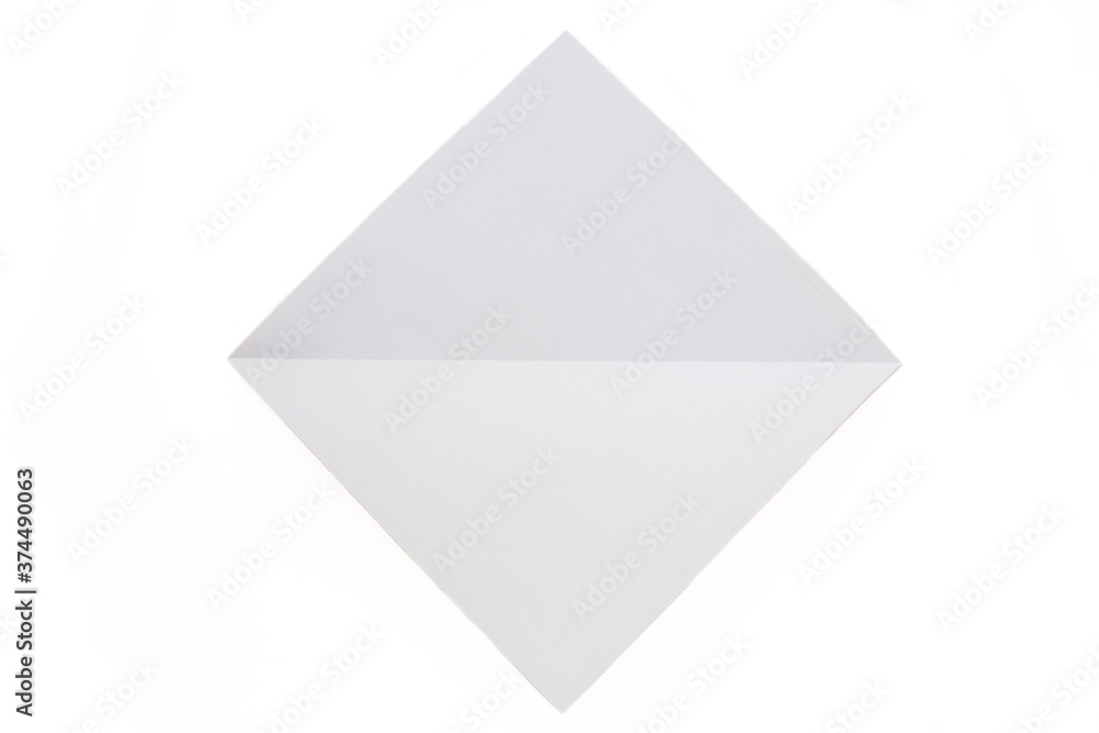 Step-by-step origami instructions. How to make a dog out of orange colored paper. Instructions on a white background top view. Step 3.. Step-by-step origami instructions. How to make a dog out of orange colored paper. Instructions on a white background top view. Step 3..