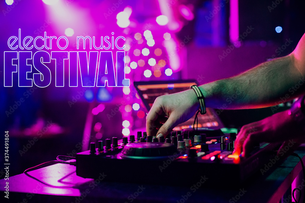 Naklejka premium inscription Electro Music Festival on the background of the hands of a DJ mixing music on a mixer