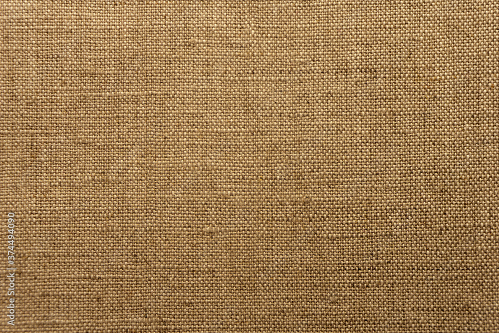 Brown background texture woven sack. The texture of a rough natural fabric. Brown background texture woven sack. The texture of a rough natural fabric.