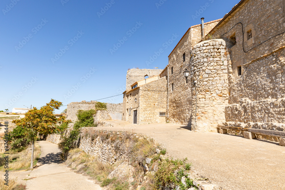 a street with typical old houses in Rello village, province of Soria, Castile and Leon, Spain