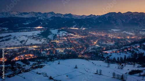 Aerial view of illuminated Zakopane in winter after dusk