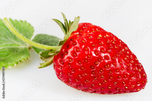 Fresh strawberry close-up on a white background