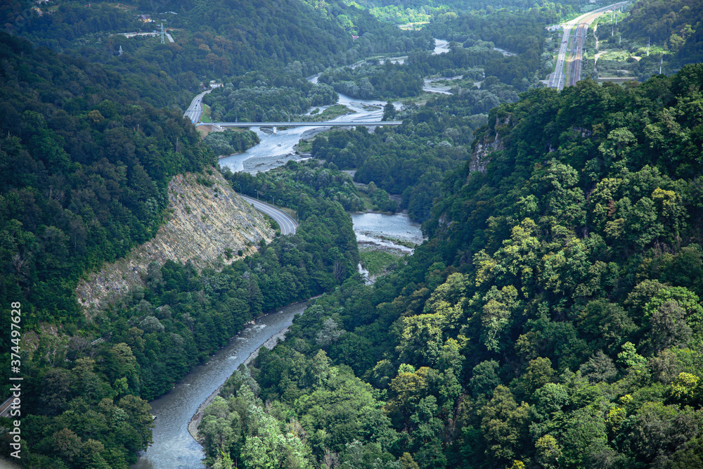 Aerial about view of mountains with green forest and river. Aerial about view of mountains with green forest and river.