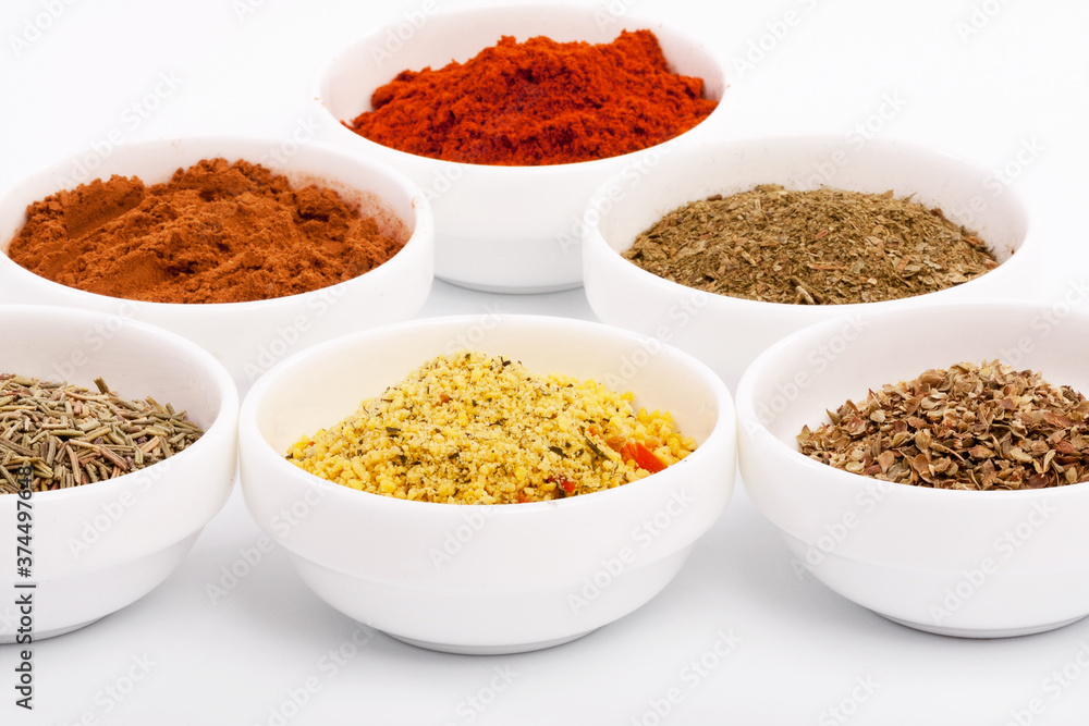 Composition with different spices on white background Composition with different spices on white background
