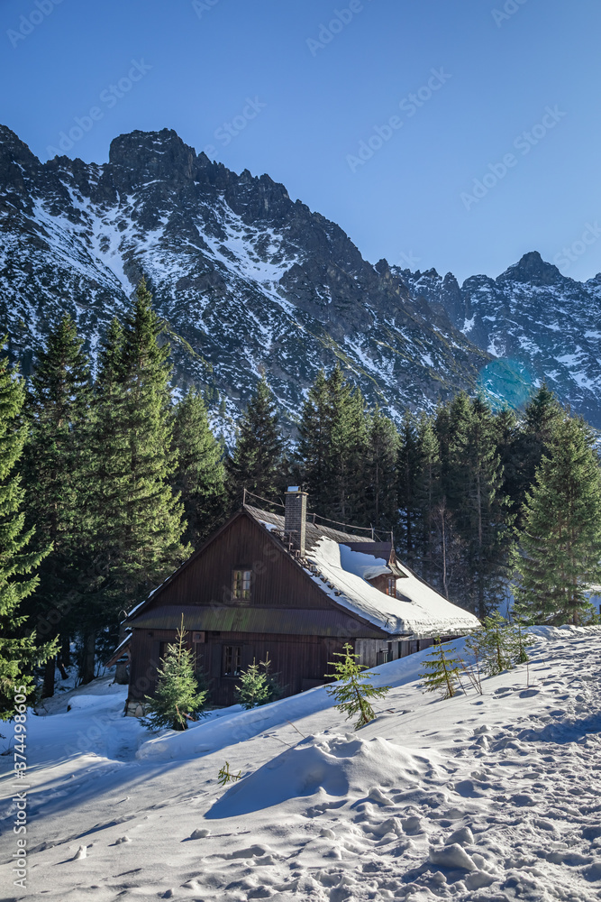 Wooden mountain shelter by sea eye lake in winter, Tatras