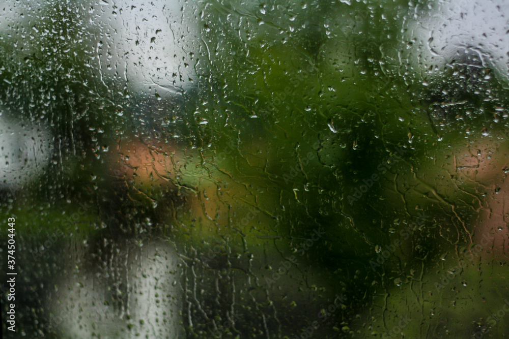 Heavy rain on the window of the car