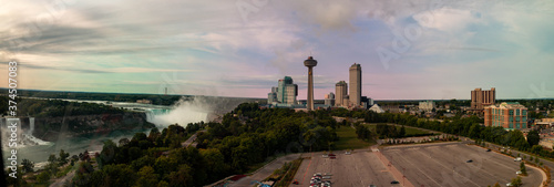 Niagara falls Canada: of an aerial panormal of the falls and the city of Niagara. Niagara is one of Canadas most popular tourist destinations and has been hit hard by covid.