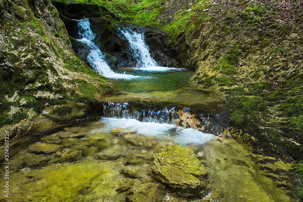 Majestic waterfalls on the stream Gačnik, Soca valley, Slovenia, Europe Majestic waterfalls on the stream Gačnik, Soca valley, Slovenia, Europe