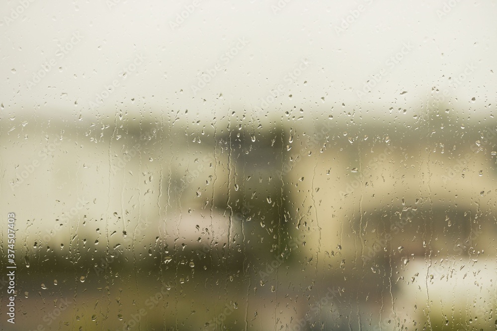Close up view of raindrops running on window glass. Beautiful nature backgrounds. Close up view of raindrops running on window glass. Beautiful nature backgrounds.