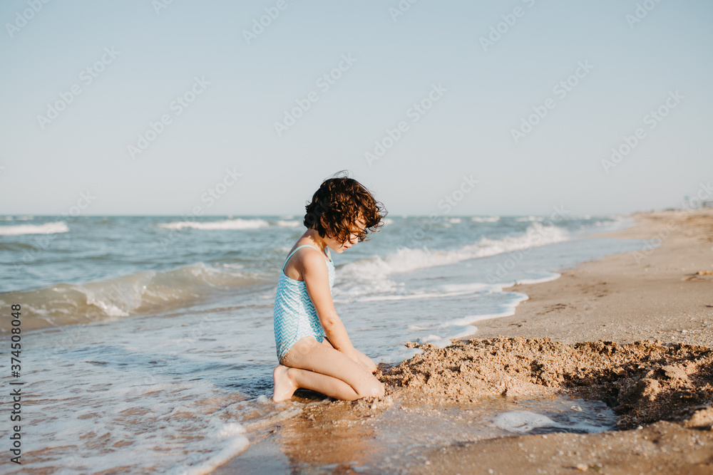 happy kids playing on beach in the day time happy kids playing on beach in the day time