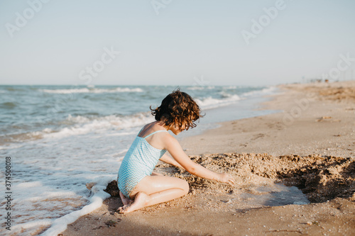 happy kids playing on beach in the day time