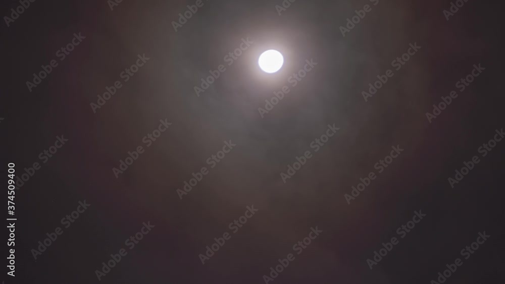Timelapse of Moon at night in the sky with moving clouds Timelapse of Moon at night in the sky with moving clouds