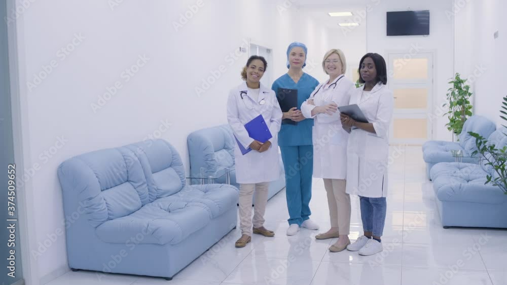 Diverse team of female medical workers smiling cam, professional health services Diverse team of female medical workers smiling cam, professional health services
