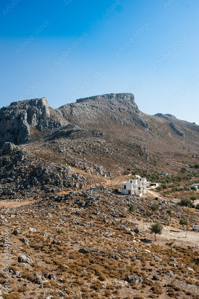 landscape in the mountains with old greek buildings
