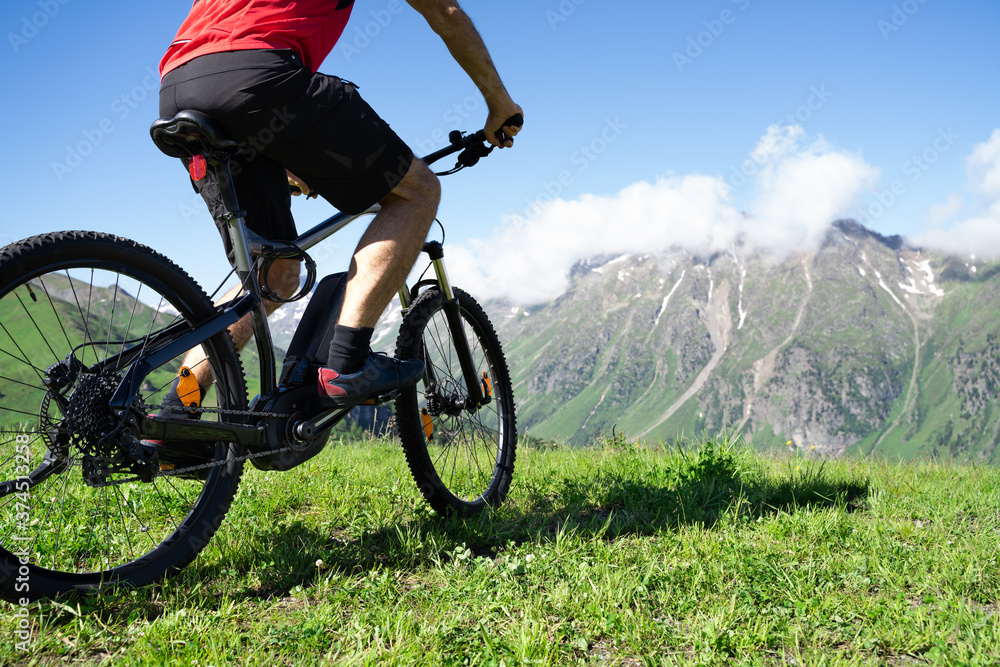 Fototapeta premium Man Riding Electric Mountain Bike