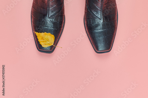 Autumn waterproof woman shoes with rain drops, copy space