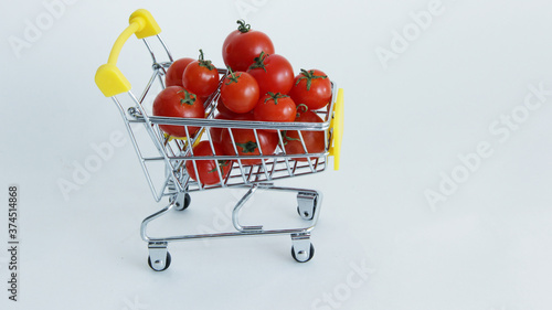 shopping cart with tomatoes