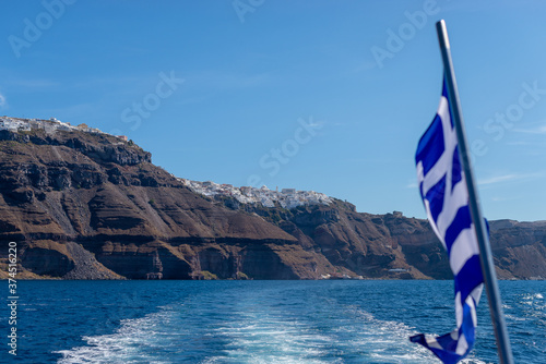 Village of Oía island of Santorini, Greece. Coast line popular white houses